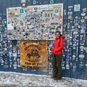 Sarah standing in front of the Prudhoe Bay sign